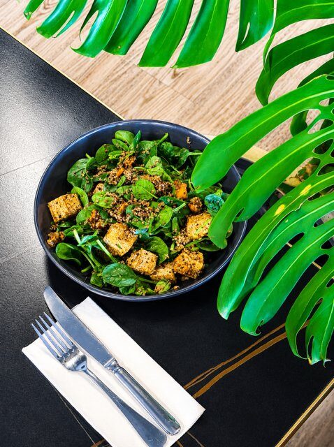 Mediterranean tofu salad with baby spinach, spiced pumpkin, Spanish onion and quinoa